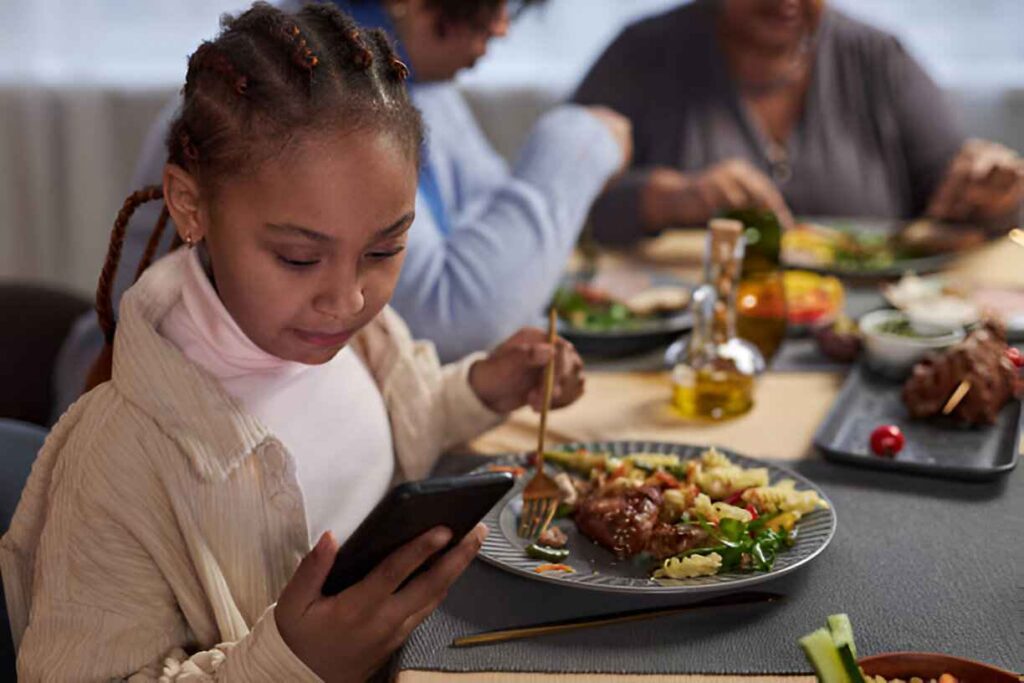 Distracted kid at dinner