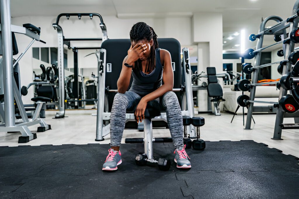 gym with someone stressed and giving up